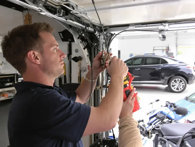 Waterbury Garage Door Repair safety certified technician performing cable replacement in Waterbury