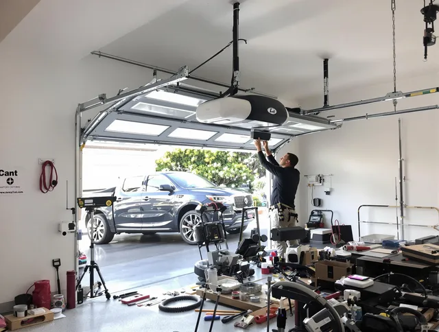 Waterbury Garage Door Repair specialist installing smart garage door opener system in Waterbury home