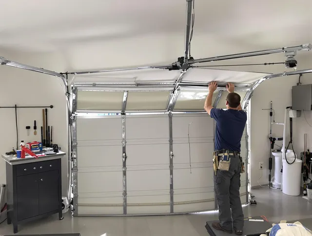Waterbury Garage Door Repair specialist performing precise section replacement on Waterbury garage door