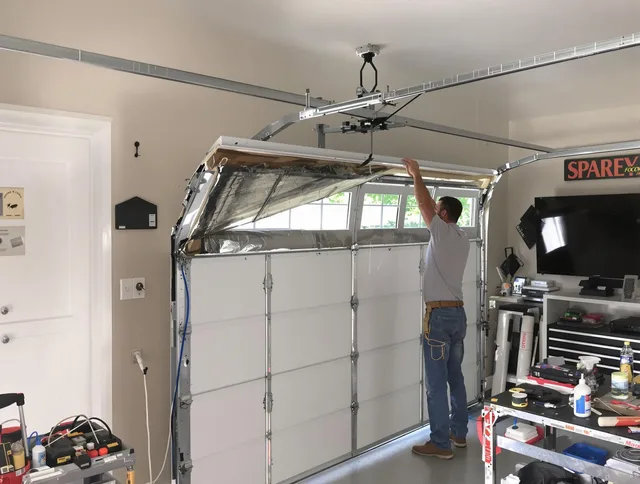 Garage door section replacement by Waterbury Garage Door Repair in Waterbury